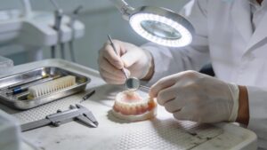 dentist repairing dentures